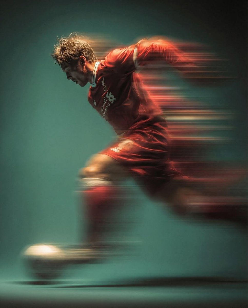 Panning shot of a soccer player kicking a ball 2