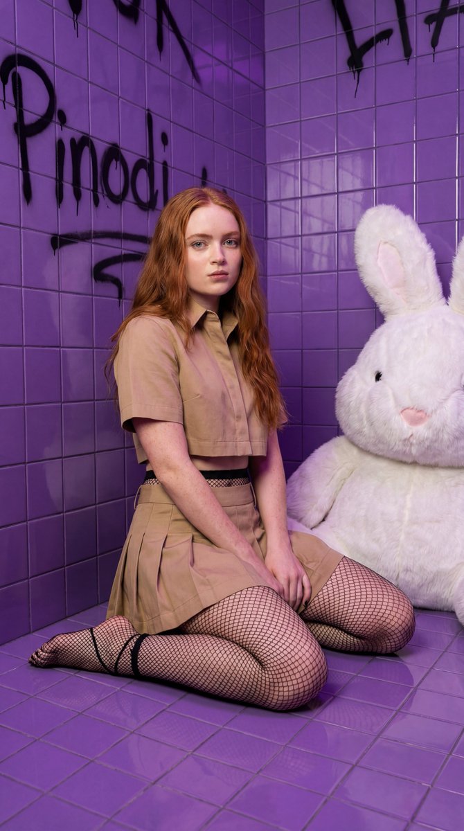 Hyper-realistic portrait of Sadie Sink in a dynamic high-fashion crouch 2